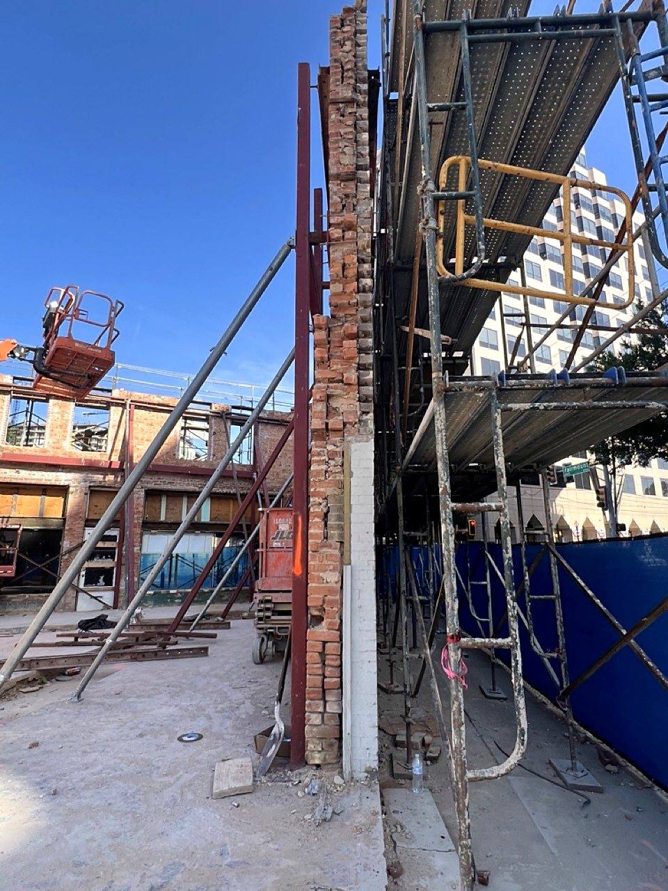 Steel shoring at a brick wall